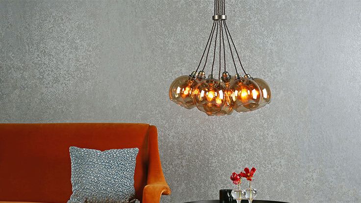 Image may contain: Chandelier, Lamp, Couch, Furniture, Architecture, Building, Indoors, Living Room, Room, and Table