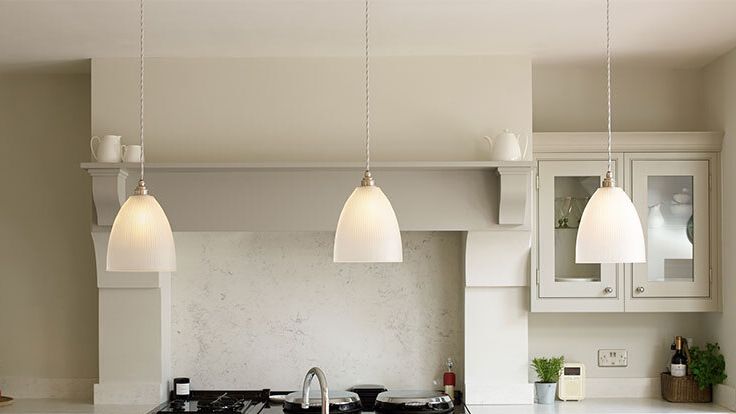 Image may contain: Lamp, Indoors, Kitchen, Plant, Light Fixture, Lighting, Interior Design, Sink, Sink Faucet, and Chair