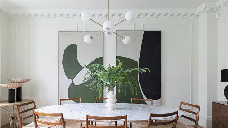 Image may contain: Architecture, Building, Dining Room, Dining Table, Furniture, Indoors, Room, Table, Chair, Plant, and Desk