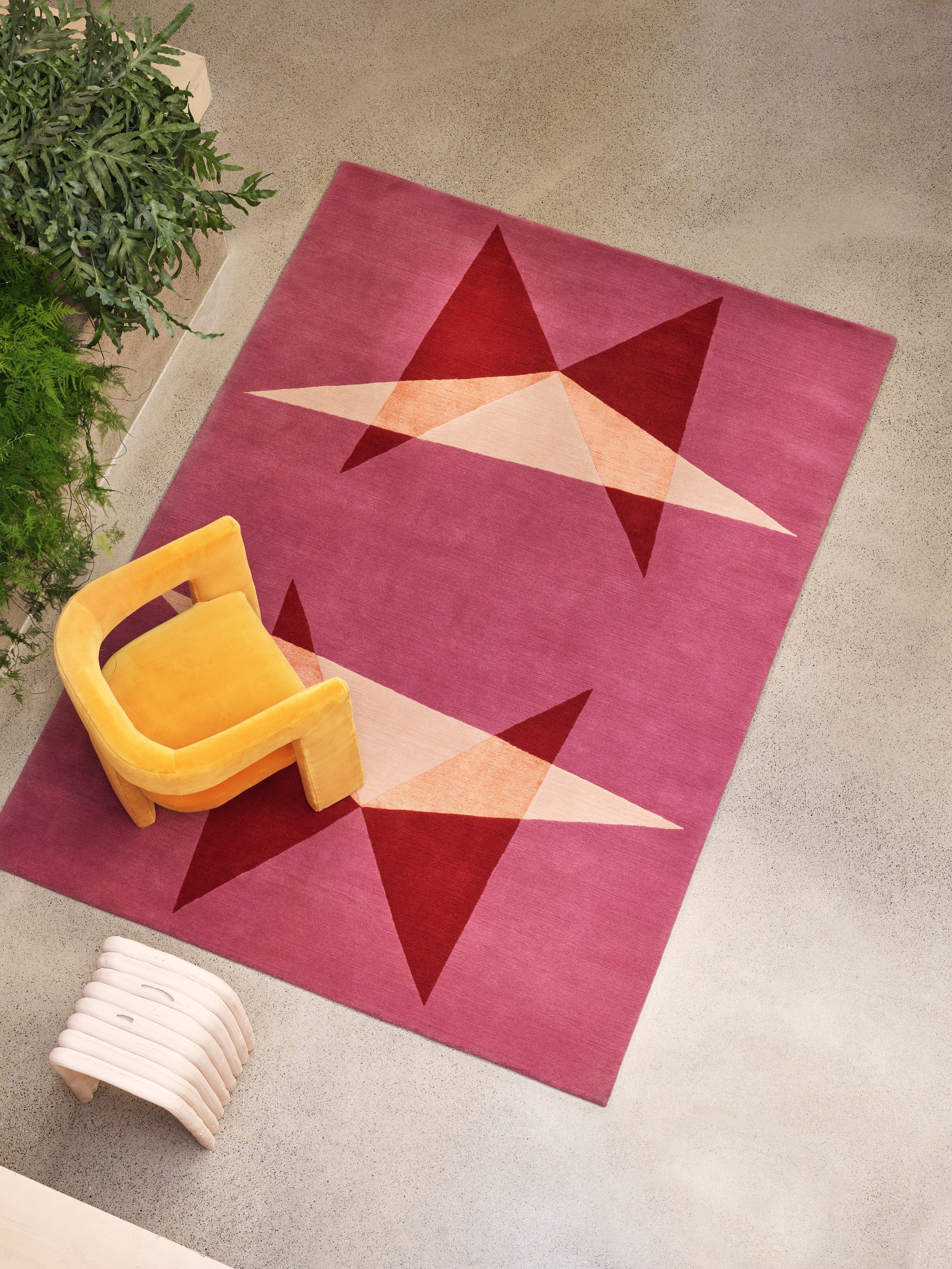 Image may contain: Home Decor, Rug, Chair, and Furniture