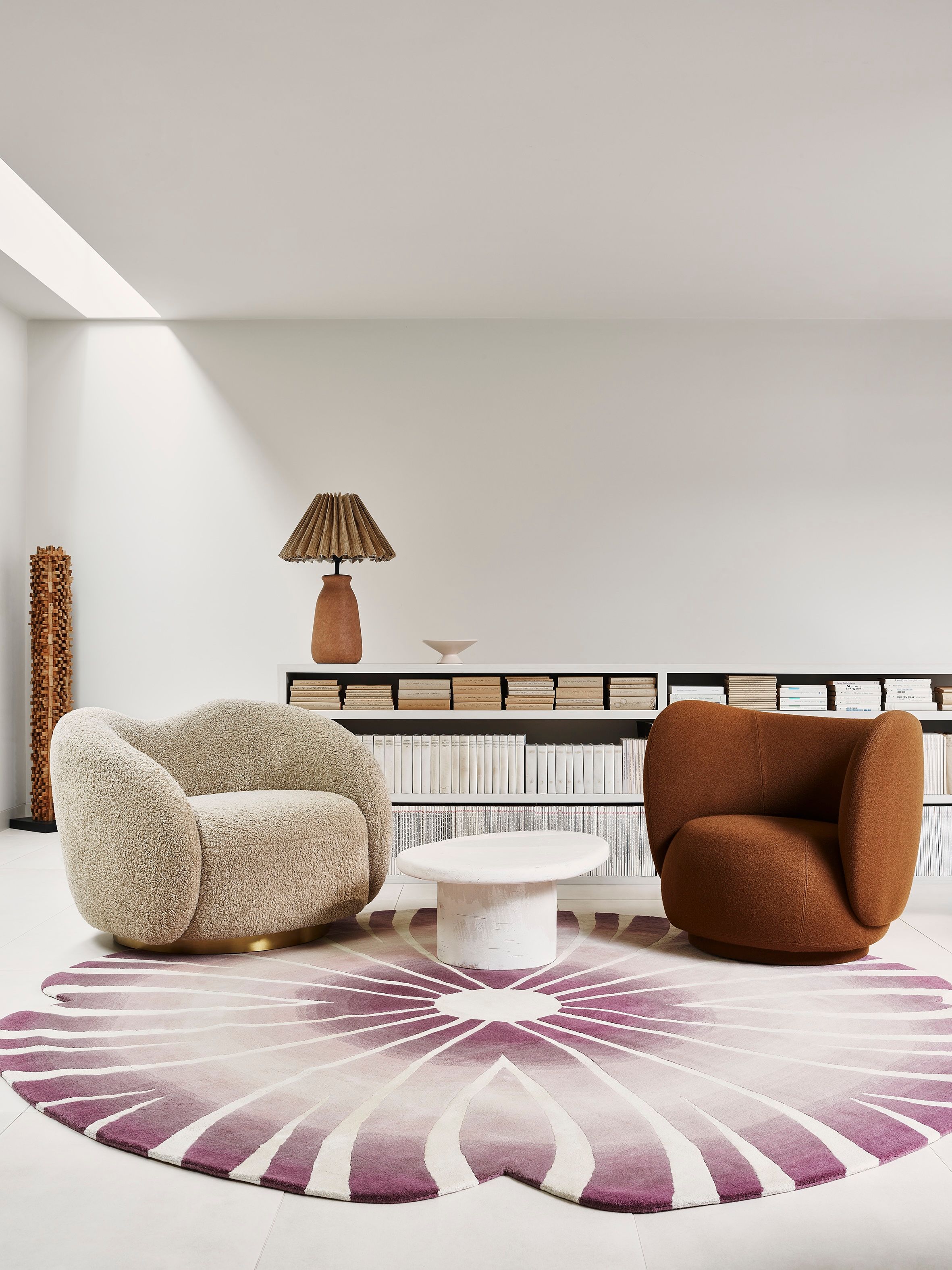 Image may contain: Home Decor, Rug, Lamp, Couch, Furniture, Table, Coffee Table, and Chair