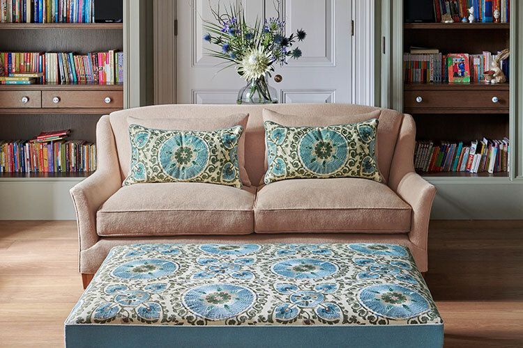 Image may contain: Furniture, Couch, Cushion, Home Decor, and Pillow