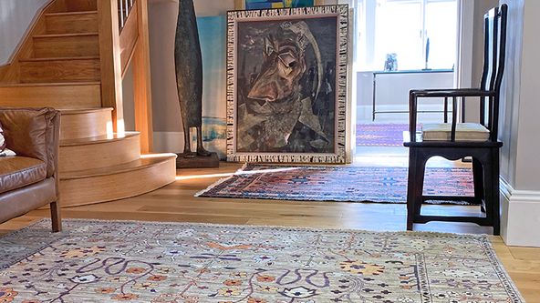 Image may contain: Home Decor, Rug, Floor, Chair, Furniture, Art, Painting, and Flooring