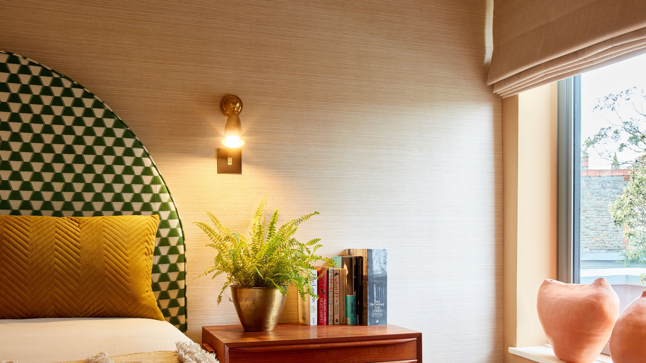 Image may contain: Home Decor, Plant, Cushion, Rug, Indoors, Interior Design, Lamp, Furniture, Bed, Bedroom, Room, and Window