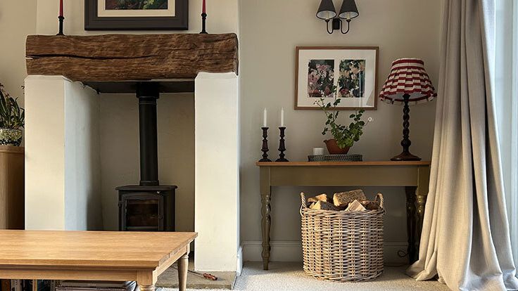 Image may contain: Lamp, Corner, Furniture, Table, Architecture, Building, Indoors, Living Room, Room, Art, and Painting