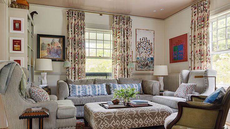 Image may contain: Home Decor, Lamp, Furniture, Couch, Chair, Art, Painting, Rug, Plant, Desk, Table, Book, and Publication