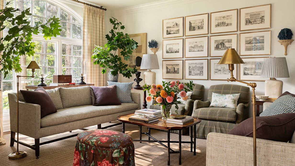 Image may contain: Home Decor, Lamp, Couch, Furniture, Plant, Table, Art, Painting, Architecture, Building, and Indoors