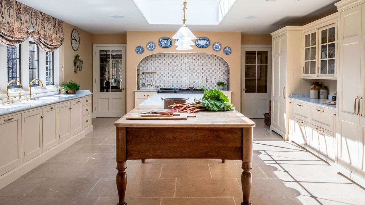 Image may contain: Indoors, Interior Design, Kitchen, Kitchen Island, Sink, Sink Faucet, Plant, Floor, Lamp, and Home Decor