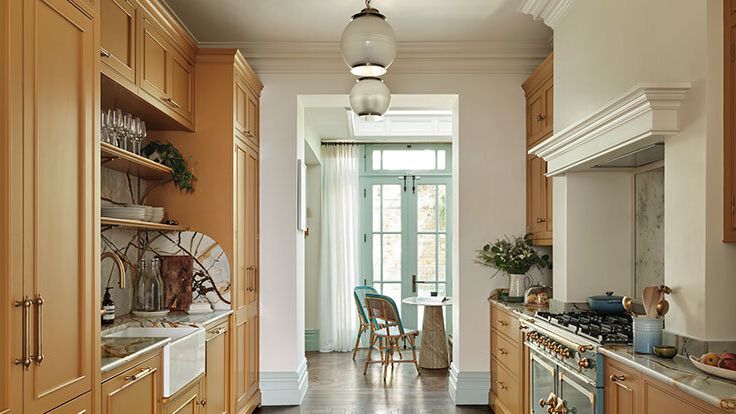 Image may contain: Indoors, Interior Design, Desk, Furniture, Table, Chair, Floor, Plant, Cooktop, Kitchen, Sink, and Plate