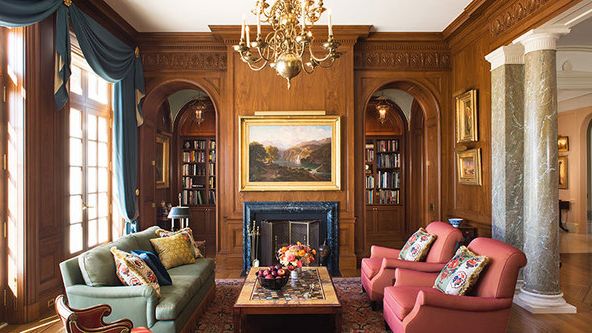 Image may contain: Home Decor, Couch, Furniture, Chair, Rug, Lamp, Architecture, Building, Indoors, Living Room, and Room