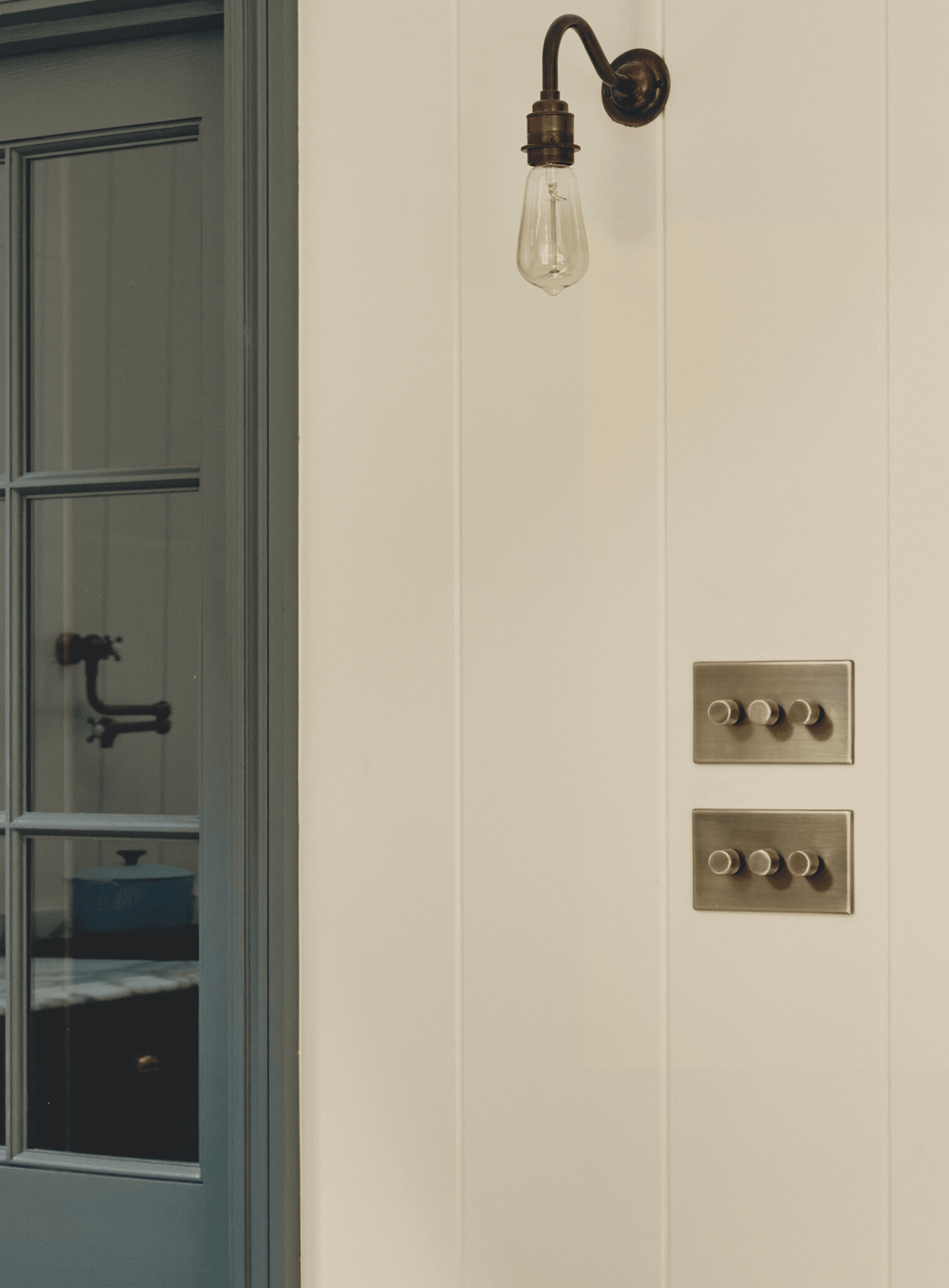 Image may contain: Indoors, Door, Light Fixture, Electrical Device, Switch, and Interior Design