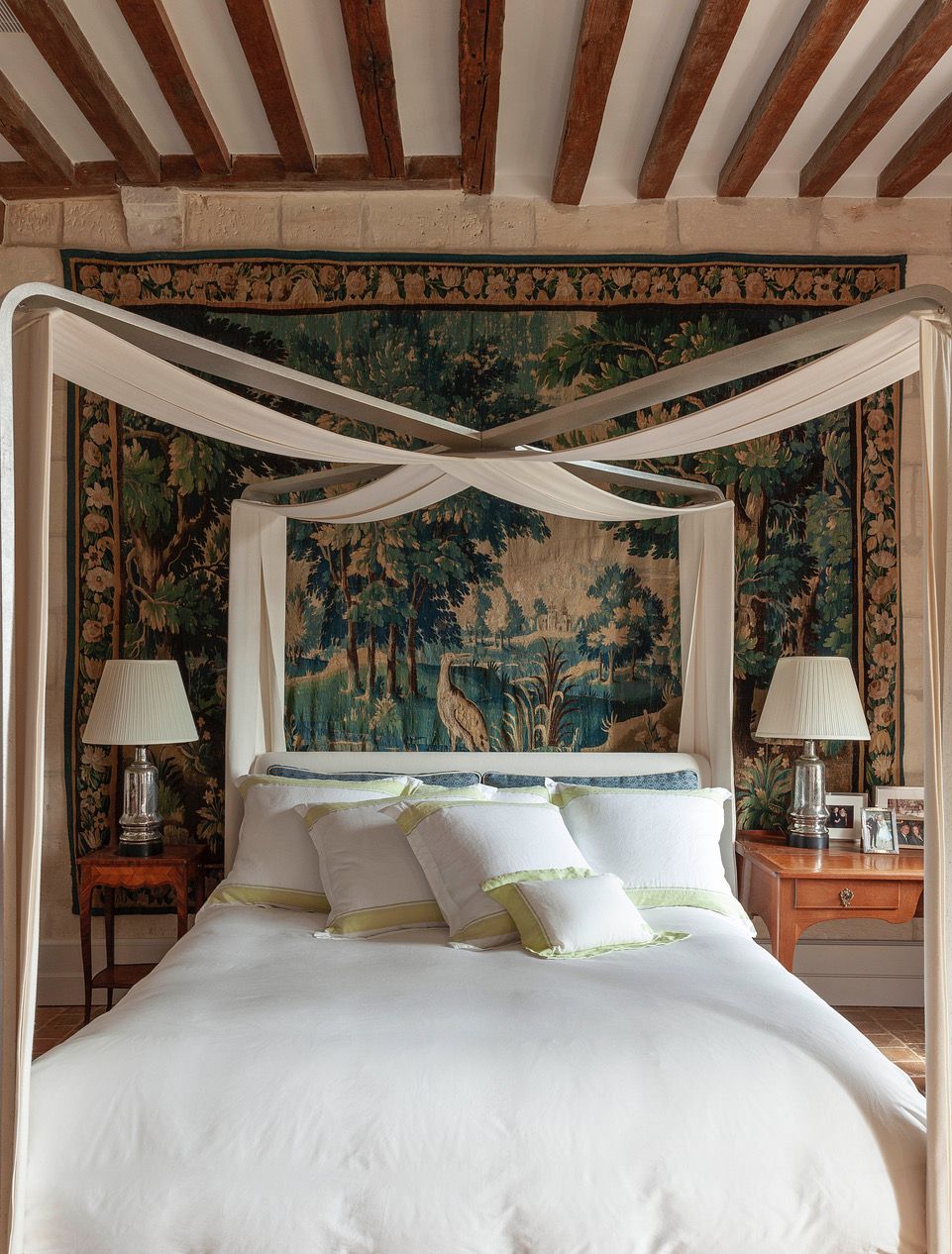 Image may contain: Furniture, Indoors, Bed, Bedroom, Room, Lamp, Person, Art, Painting, Canopy Bed, Animal, and Bird