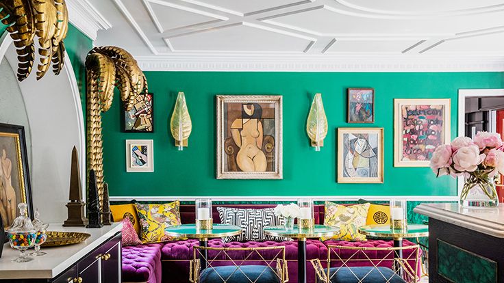 Image may contain: Home Decor, Art, Painting, Furniture, Desk, Table, Person, and Indoors