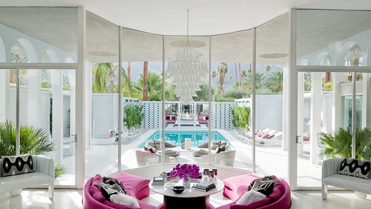 Image may contain: Architecture, Building, Furniture, Indoors, Living Room, Room, Home Decor, Table, Couch, and Dining Room