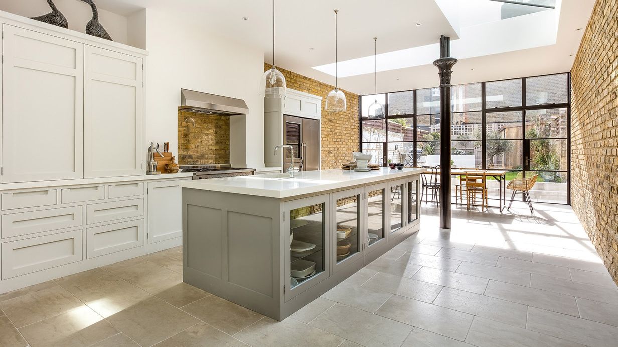 Image may contain: Indoors, Interior Design, Floor, Kitchen, Kitchen Island, Chair, and Furniture