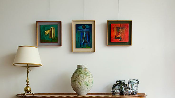 Image may contain: Lamp, Furniture, Sideboard, Table Lamp, Indoors, Interior Design, and Cabinet