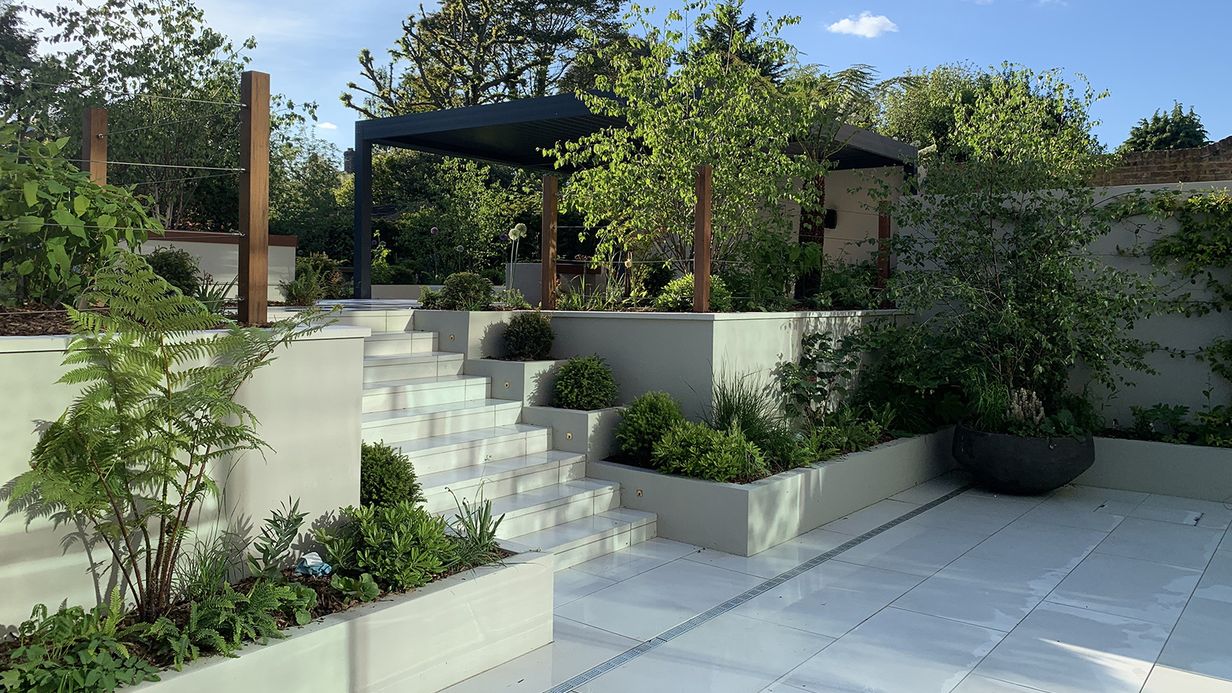 Image may contain: Backyard, Nature, Outdoors, Yard, Plant, Potted Plant, Terrace, Garden, Jar, Planter, Pottery, and Vase