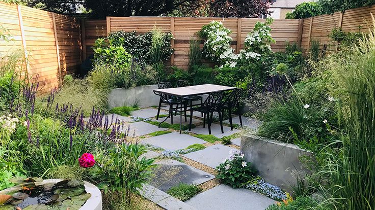 Image may contain: Backyard, Nature, Outdoors, Yard, Garden, Desk, Furniture, Table, Chair, Indoors, and Interior Design