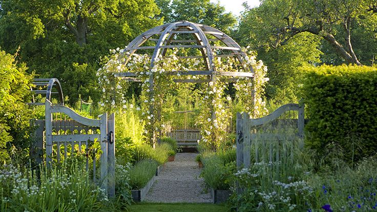 Image may contain: Garden, Nature, Outdoors, Arbour, Grass, Park, Plant, Architecture, Building, House, Housing, and Porch