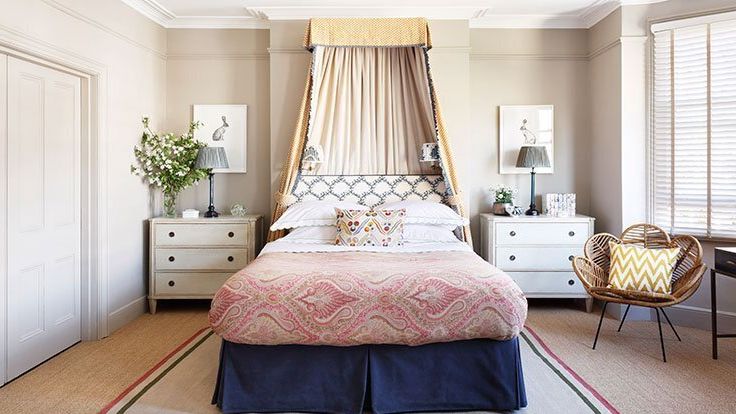 Image may contain: Home Decor, Lamp, Rug, Indoors, Interior Design, Plant, Chair, Furniture, Bed, Bedroom, and Room