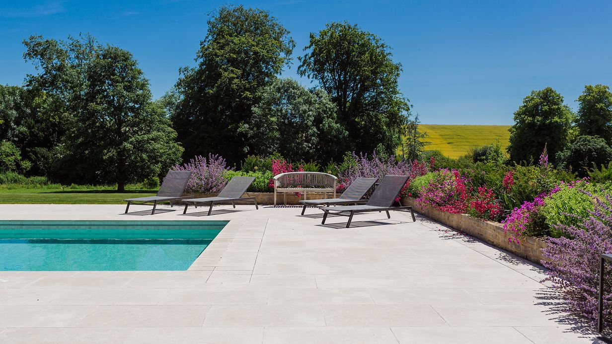 Image may contain: Backyard, Nature, Outdoors, Yard, Chair, Furniture, Bench, Grass, Plant, Scenery, Garden, Park, and Pool