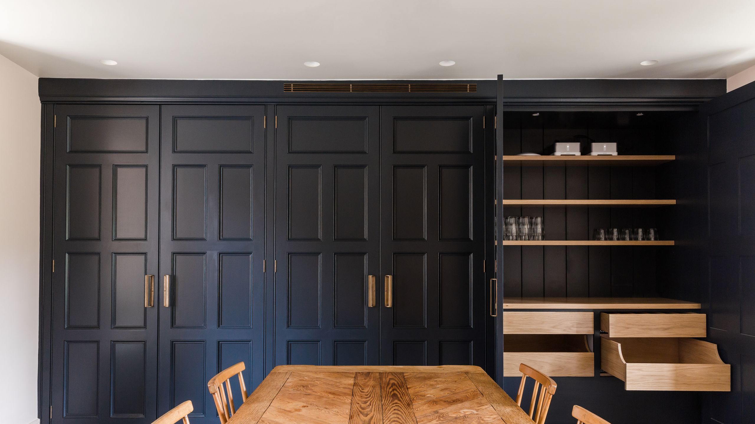 Image may contain: Indoors, Interior Design, Wood, Architecture, Building, Dining Room, Dining Table, Furniture, and Room