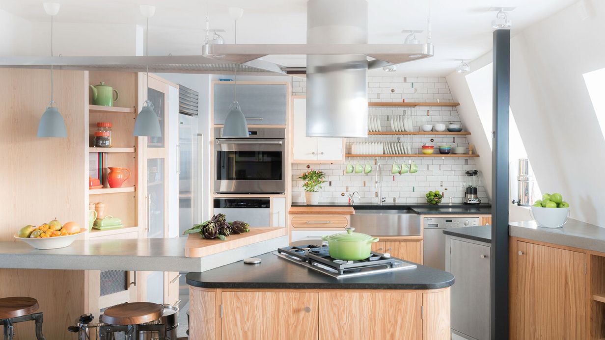 Image may contain: Indoors, Kitchen, Interior Design, Cooktop, Lamp, and Kitchen Island