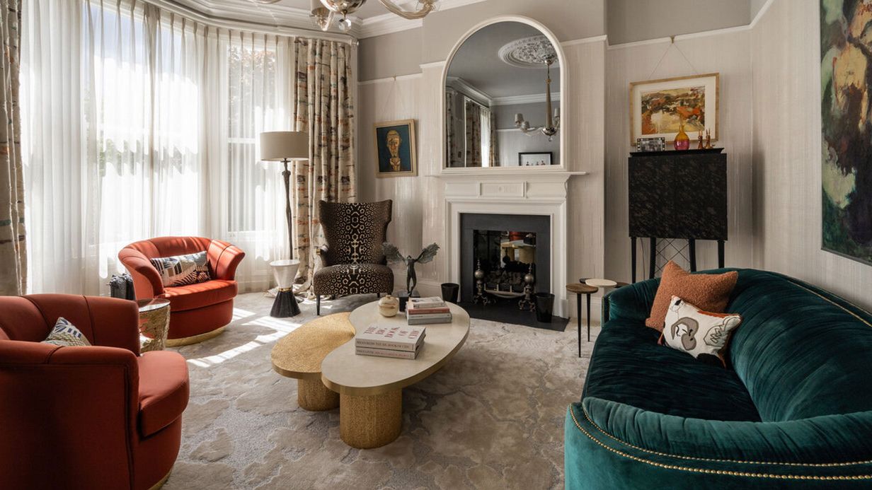 Image may contain: Home Decor, Architecture, Building, Furniture, Indoors, Living Room, Room, Chair, Table, Couch, and Art