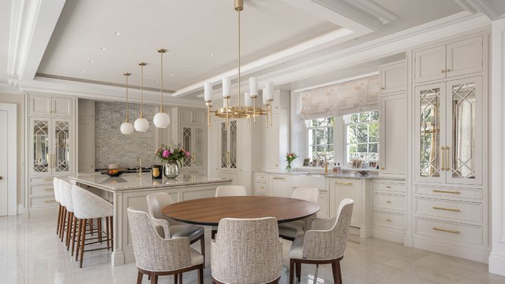 Image may contain: Architecture, Building, Dining Room, Dining Table, Furniture, Indoors, Room, Table, Lamp, and Chair