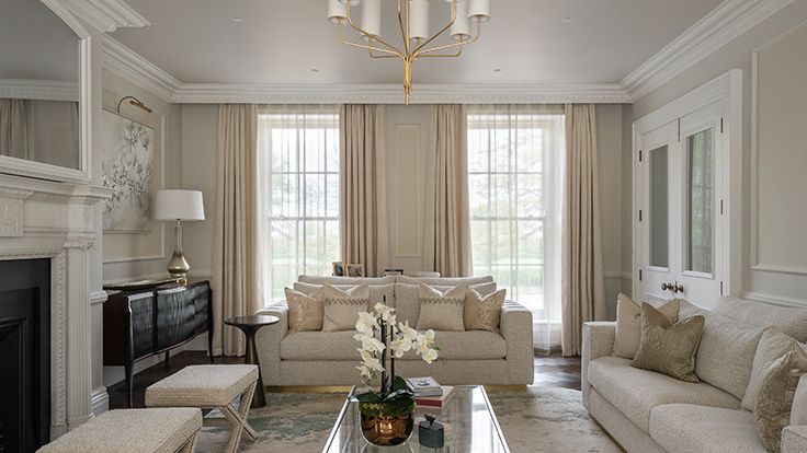 Image may contain: Lamp, Home Decor, Furniture, Table, Couch, Architecture, Building, Indoors, Living Room, Room, and Book