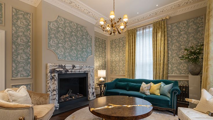 Image may contain: Home Decor, Lamp, Plant, Furniture, Table, Couch, Coffee Table, Architecture, Building, and Indoors