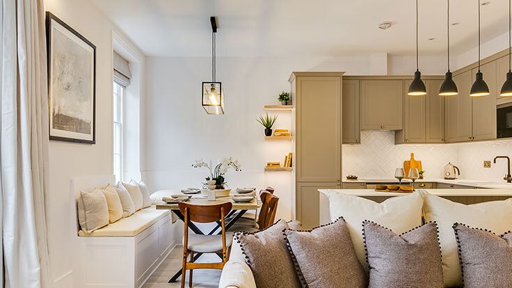 Image may contain: Home Decor, Cushion, Lamp, Indoors, Interior Design, Plant, Couch, Furniture, Architecture, and Building