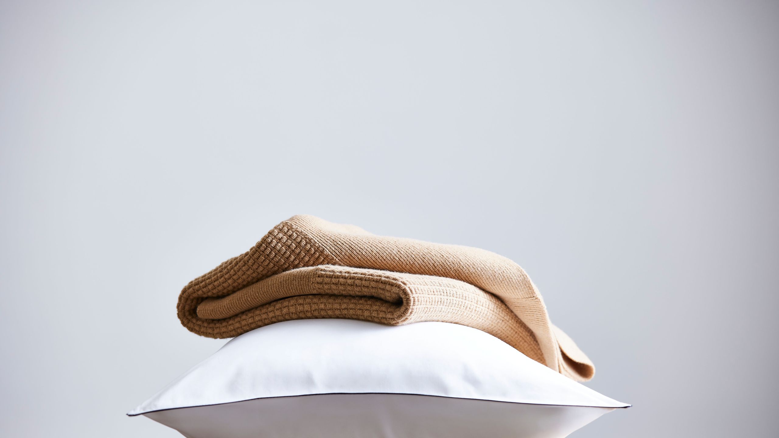 Image may contain: Cushion, Home Decor, Pillow, Linen, and Blanket