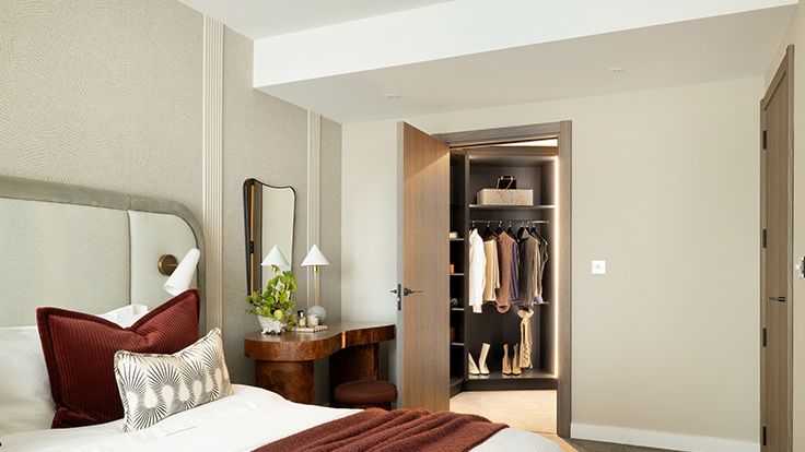 Image may contain: Corner, Desk, Furniture, Table, Bed, Lamp, Plant, Indoors, Cup, Cushion, Home Decor, Accessories, and Bag