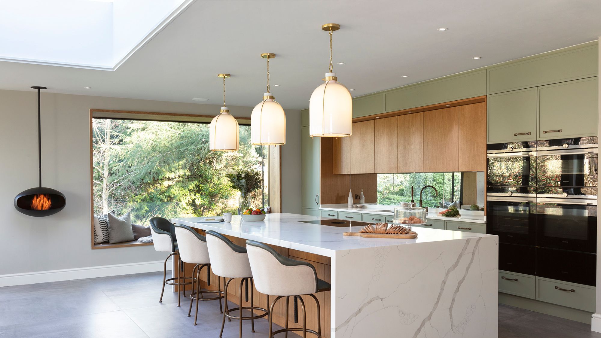 Image may contain: Architecture, Building, Dining Room, Dining Table, Furniture, Indoors, Room, Table, and Kitchen