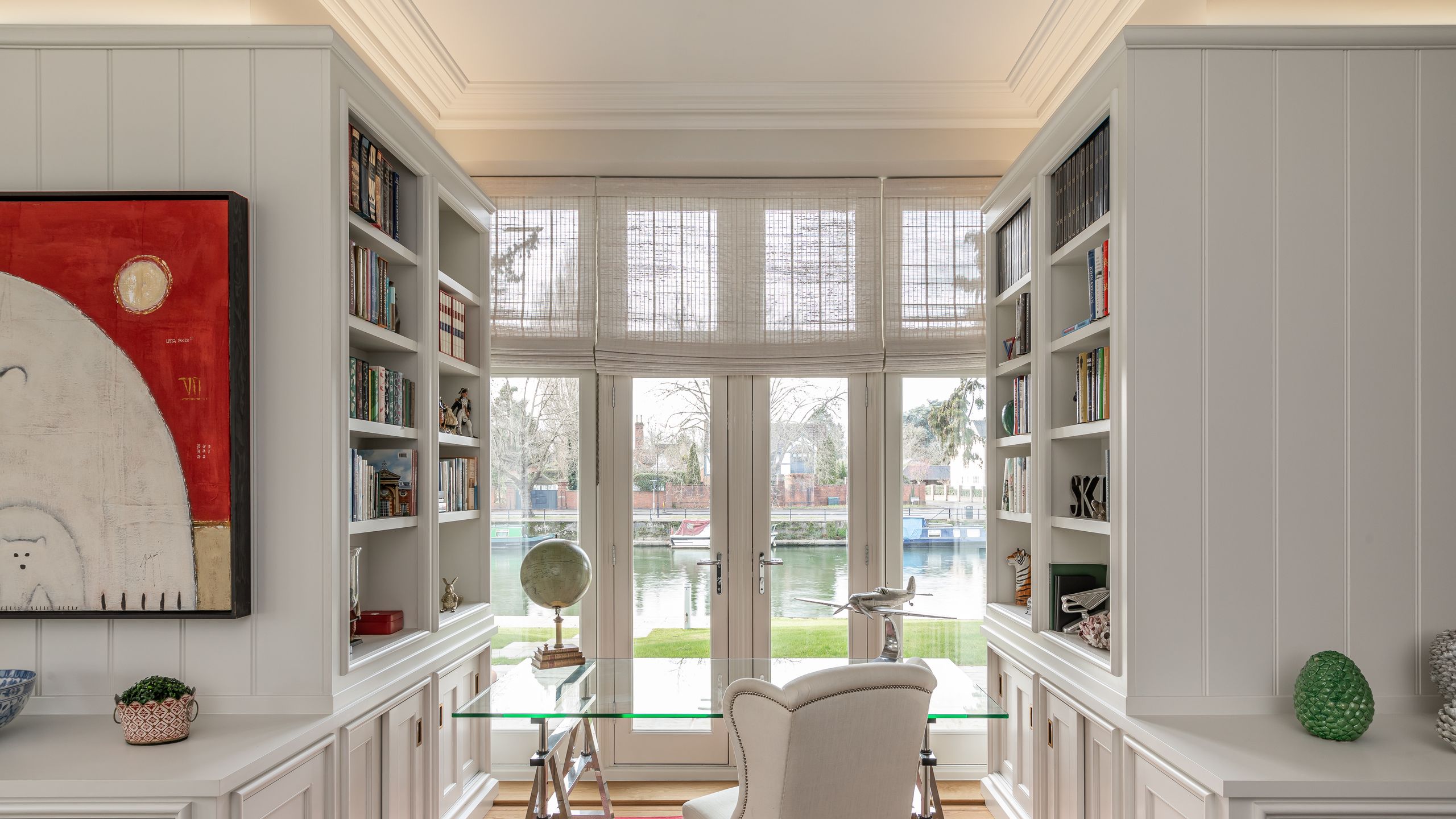 Image may contain: Home Decor, Rug, Indoors, Interior Design, Chair, Furniture, Door, Window, and Person