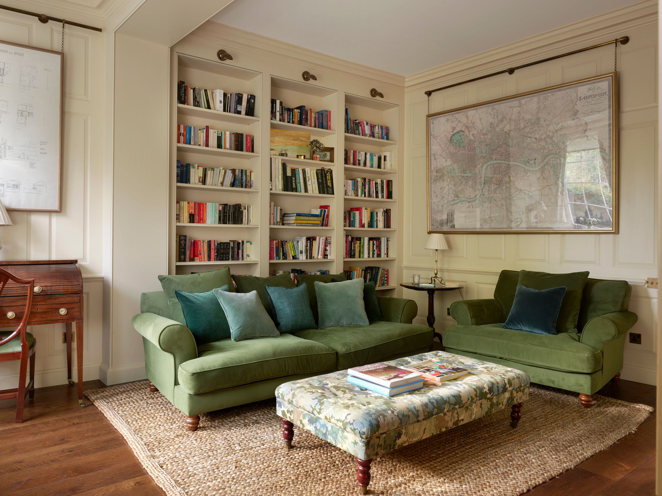 Image may contain: Home Decor, Furniture, Couch, Rug, Lamp, Chair, Art, Painting, Desk, and Table