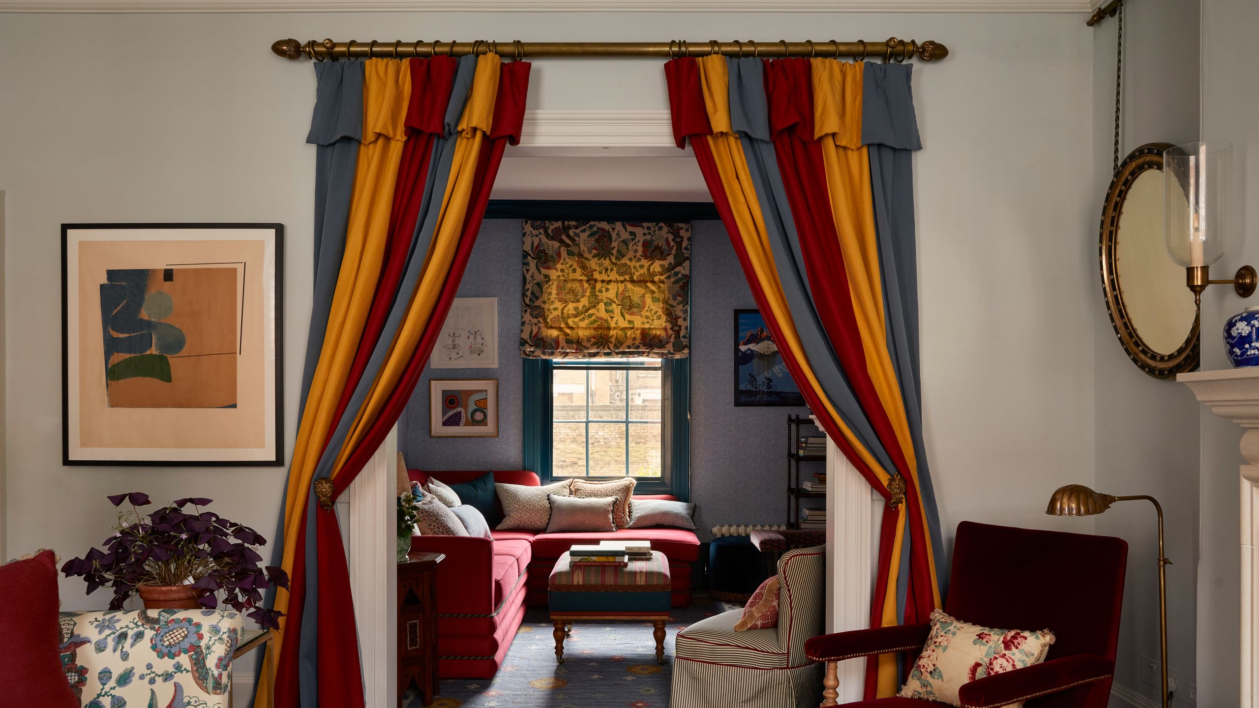 Image may contain: Architecture, Building, Furniture, Indoors, Living Room, Room, Plant, Chair, Art, Painting, and Home Decor