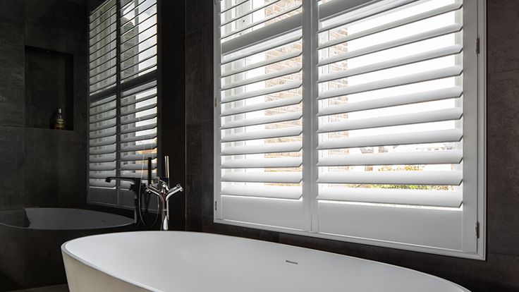 Image may contain: Bathing, Bathtub, Person, Tub, Window, and Curtain