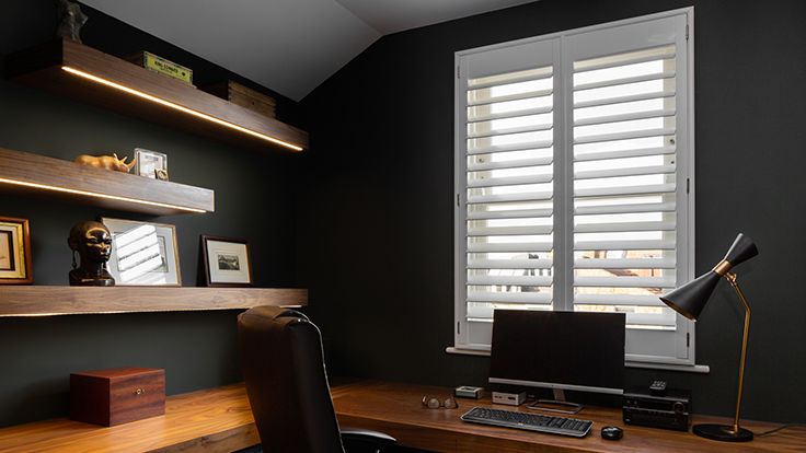 Image may contain: Lamp, Chair, Furniture, Computer, Computer Hardware, Computer Keyboard, Electronics, Hardware, and Table