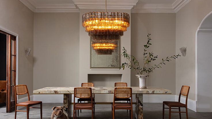 Image may contain: Architecture, Building, Dining Room, Dining Table, Furniture, Indoors, Room, Table, Chandelier, and Lamp