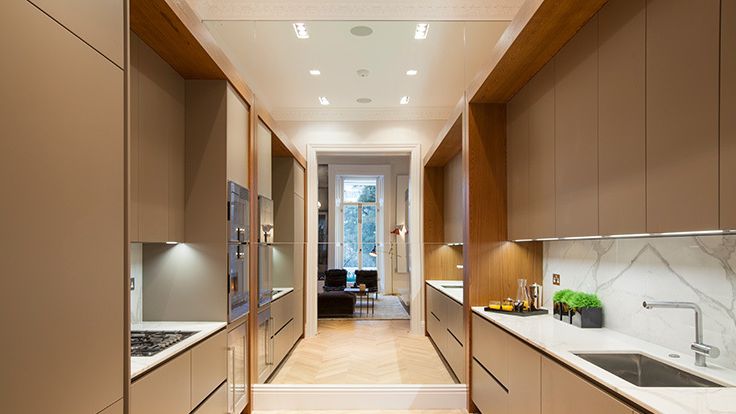 Image may contain: Indoors, Interior Design, Sink, Kitchen, Home Decor, Rug, Plant, Sink Faucet, Wood, Floor, and Cooktop