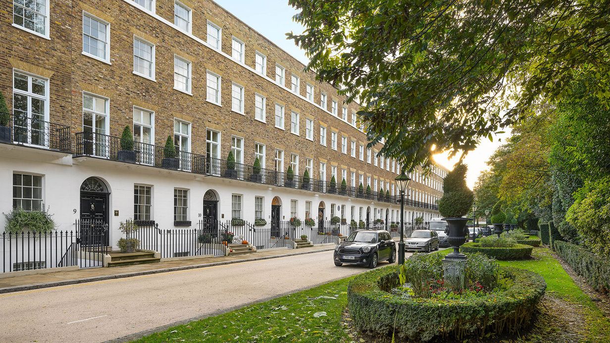 Image may contain: City, Urban, Plant, Car, Transportation, Vehicle, Road, Street, Architecture, Building, and Housing