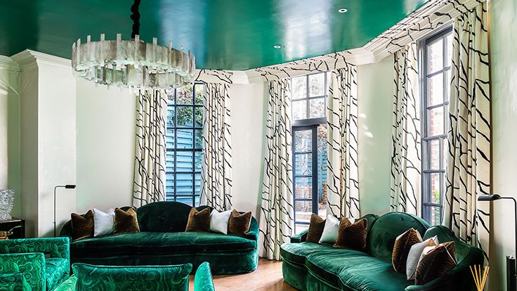 Image may contain: Couch, Furniture, Home Decor, Lamp, Architecture, Building, Indoors, Living Room, and Room