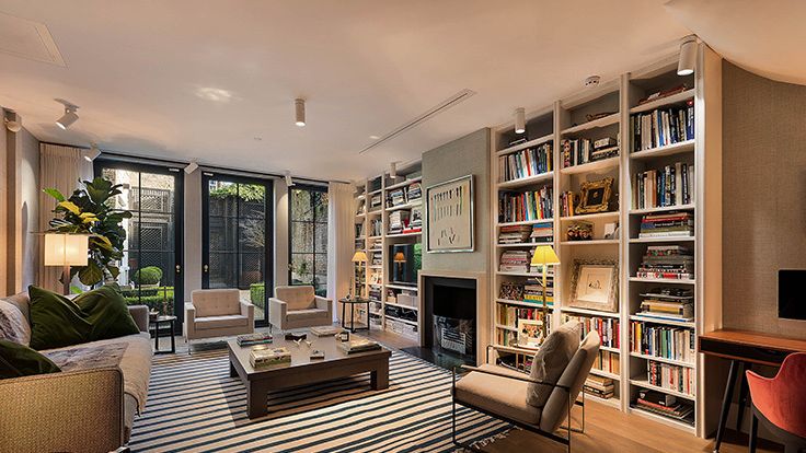 Image may contain: Chair, Furniture, Home Decor, Rug, Couch, Lamp, Table, Desk, Art, Painting, and Computer Hardware