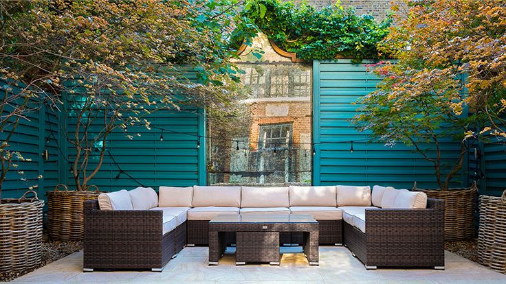 Image may contain: Couch, Furniture, Indoors, Interior Design, Backyard, Nature, Outdoors, Yard, Home Decor, and Table