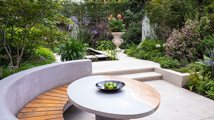 Image may contain: Furniture, Table, Coffee Table, Backyard, Nature, Outdoors, Yard, Tabletop, Dining Table, Plate, and Desk