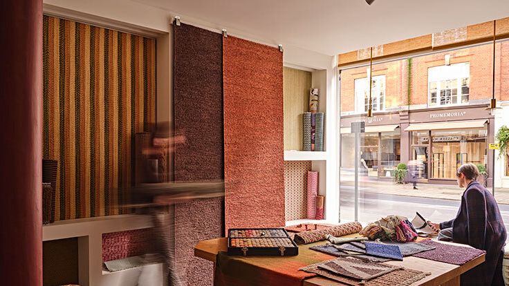 Image may contain: Indoors, Interior Design, Furniture, Table, Desk, Clothing, Footwear, High Heel, Shoe, Adult, and Person