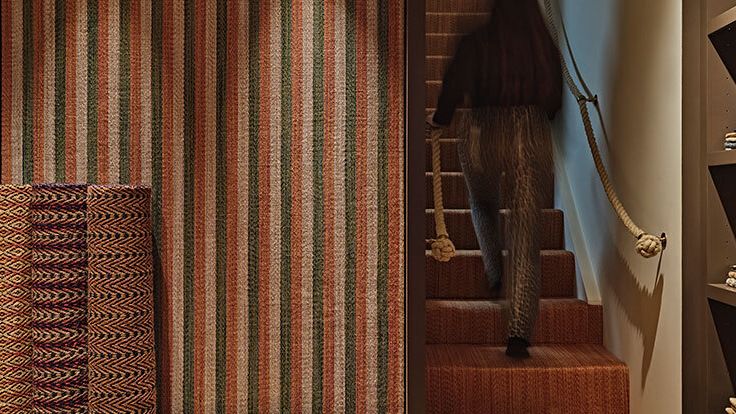 Image may contain: Indoors, Interior Design, Home Decor, Rug, Adult, and Person