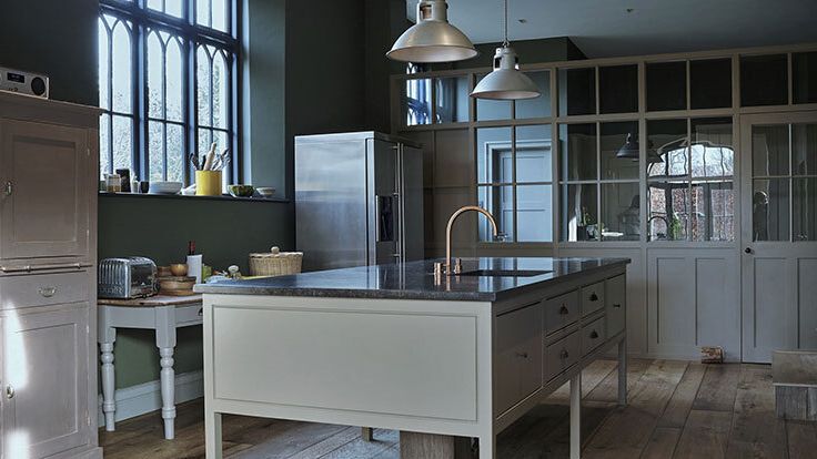 Image may contain: Indoors, Kitchen, Interior Design, Sink, Sink Faucet, Kitchen Island, Lamp, Appliance, and Device